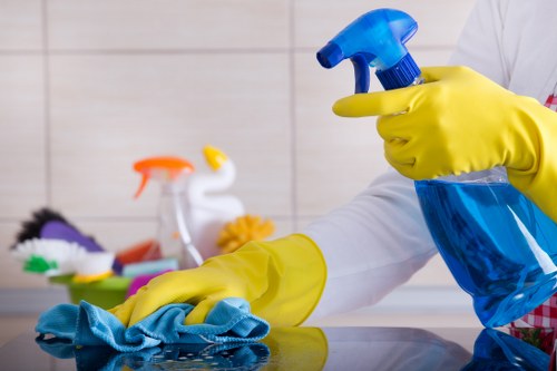 Professional carpet cleaner in Kingston upon Thames deep cleaning a living room carpet