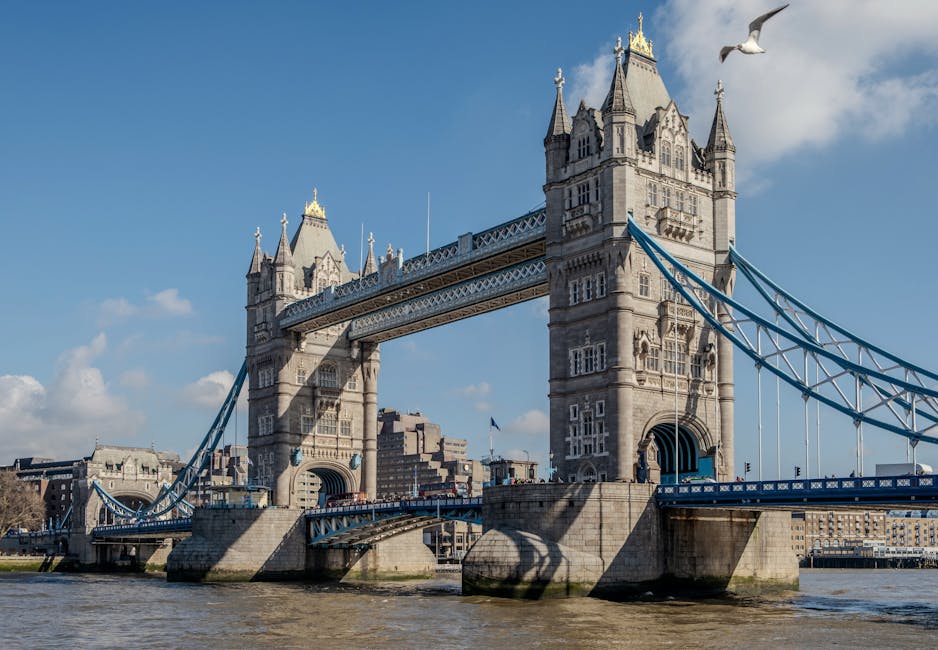Close-up view of the concrete structure of London Bridge, showing its arches and support pillars spanning over the River Thames. The bridge's surface appears clean and well-maintained, with a smooth, light grey concrete finish. In the background, modern glass buildings reflect light, adding a contemporary urban atmosphere to the scene. The water below is dark with gentle ripples, emphasizing the sturdy construction of the bridge. The image highlights an architectural element of Kingston upon Thames near Kingston Bridge, with natural lighting enhancing the clarity and details of the concrete surfaces. This scene exemplifies surface cleanliness and structural integrity associated with professional maintenance, similar to the detailed surface cleaning and deep cleaning services offered by [COMPANY_NAME] in Kingston upon Thames.